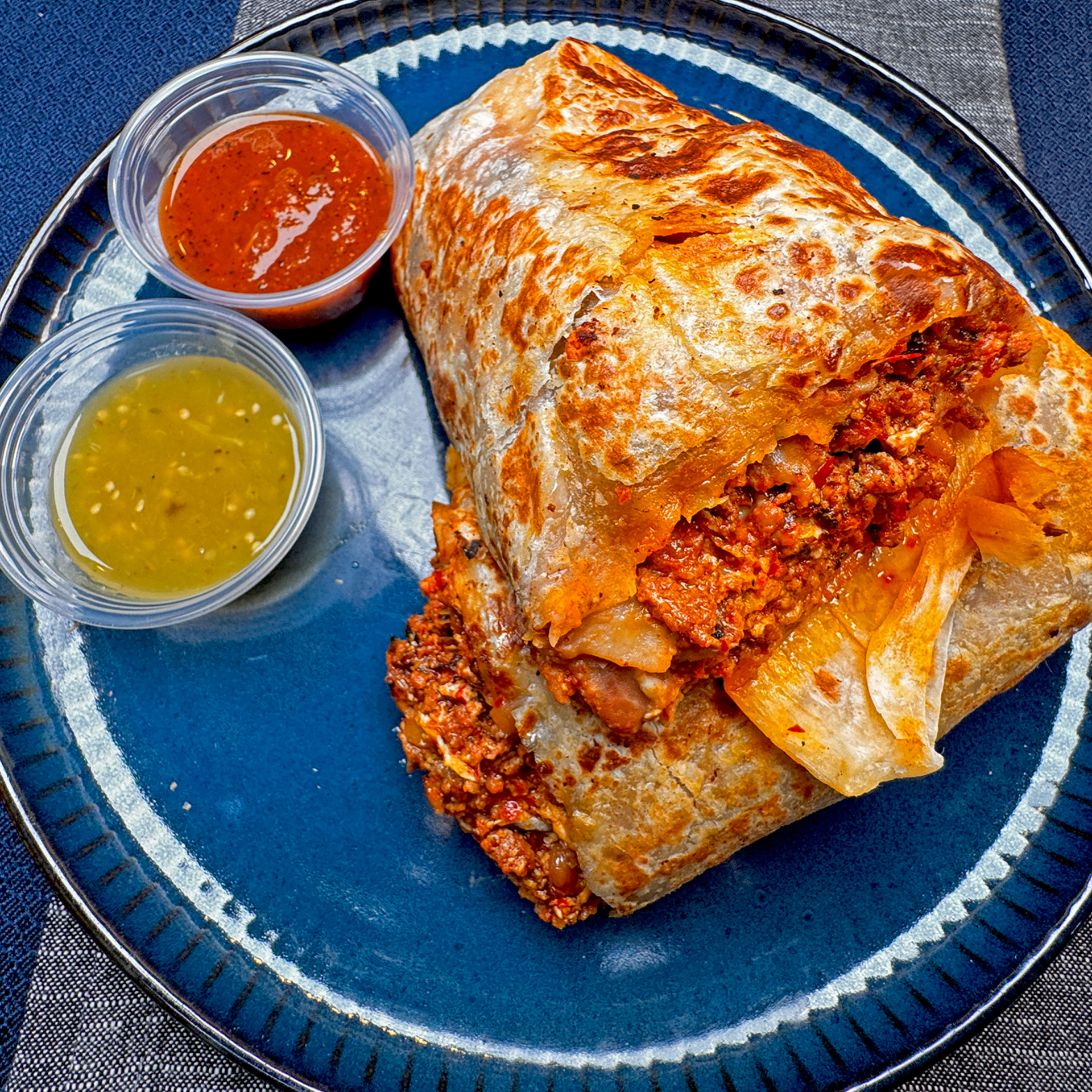 A massive burrito packed with flavorful chorizo, rice, beans, and fresh toppings.