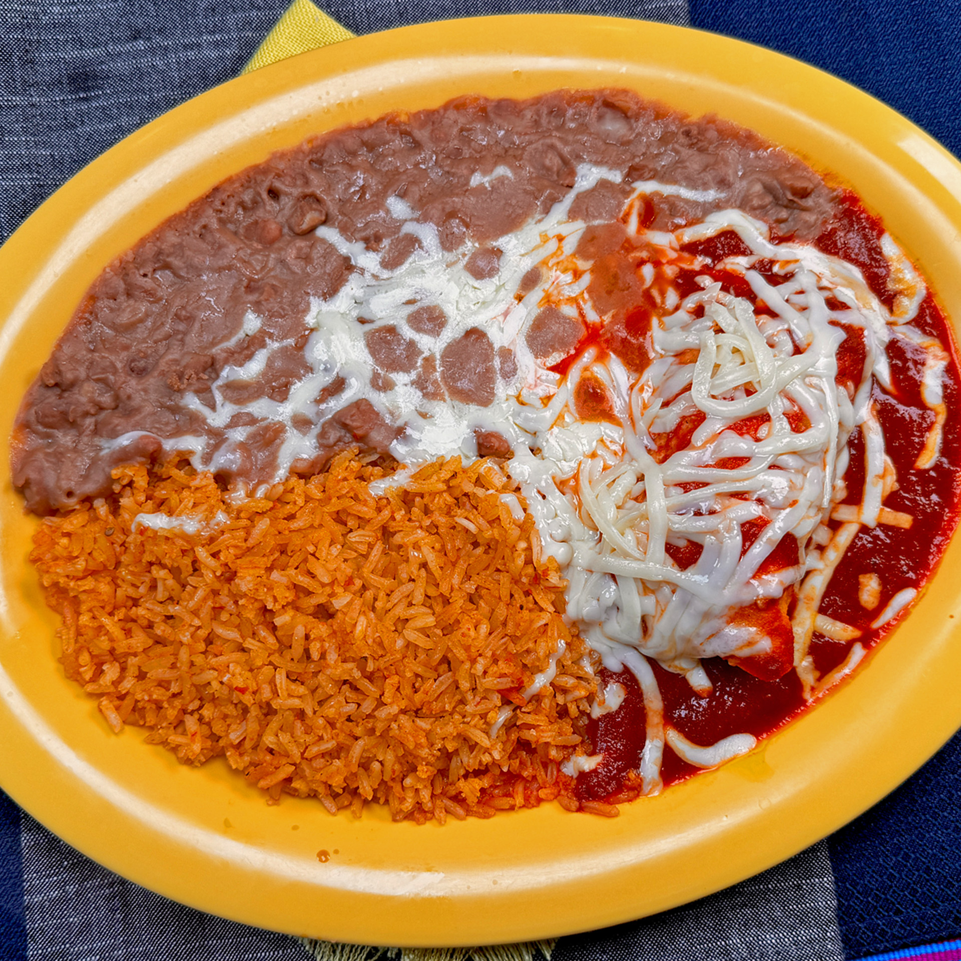 Soft corn tortillas filled with your choice of meat, smothered in rich enchilada sauce.