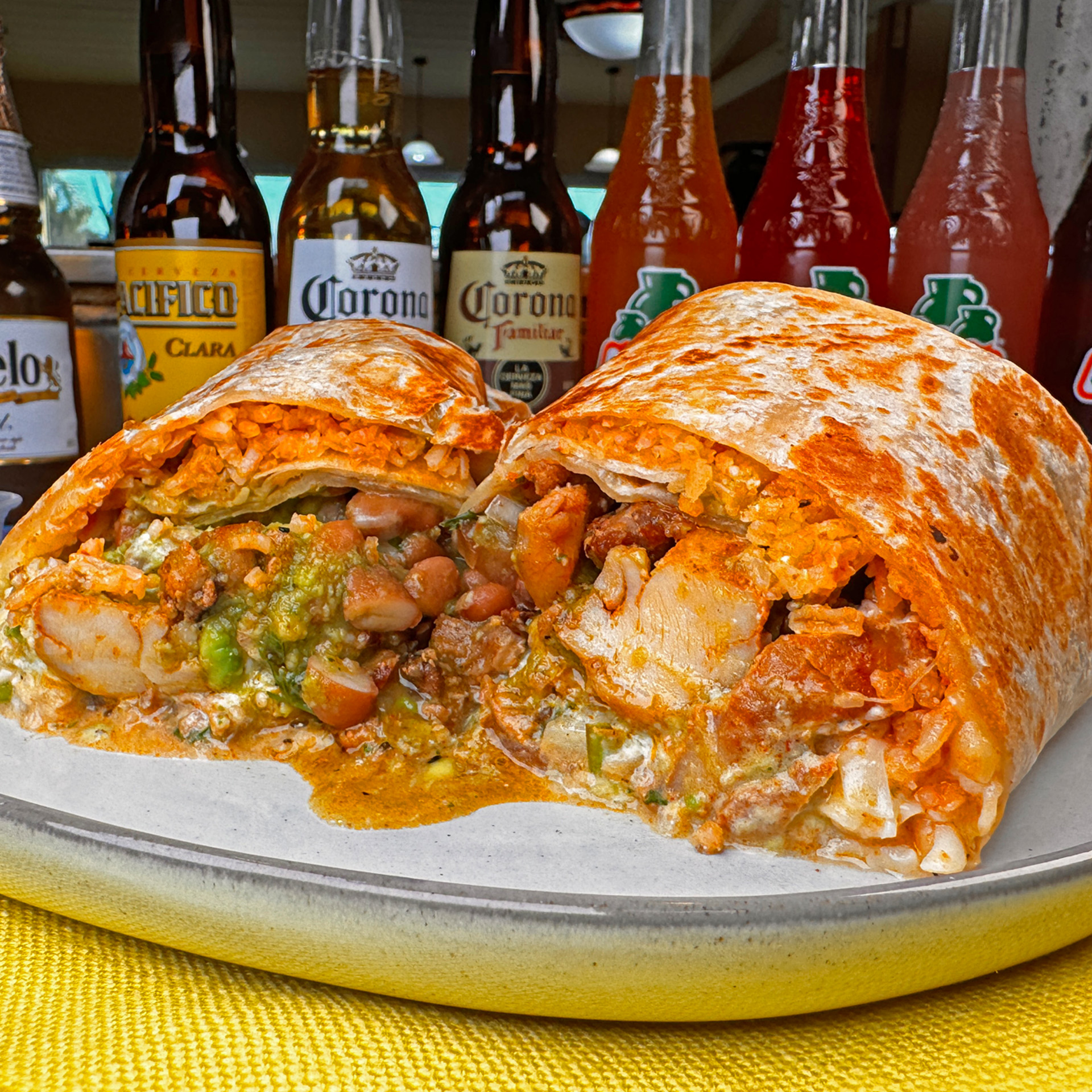 Tender grilled chicken wrapped in a warm tortilla with rice, beans, and creamy sauce.