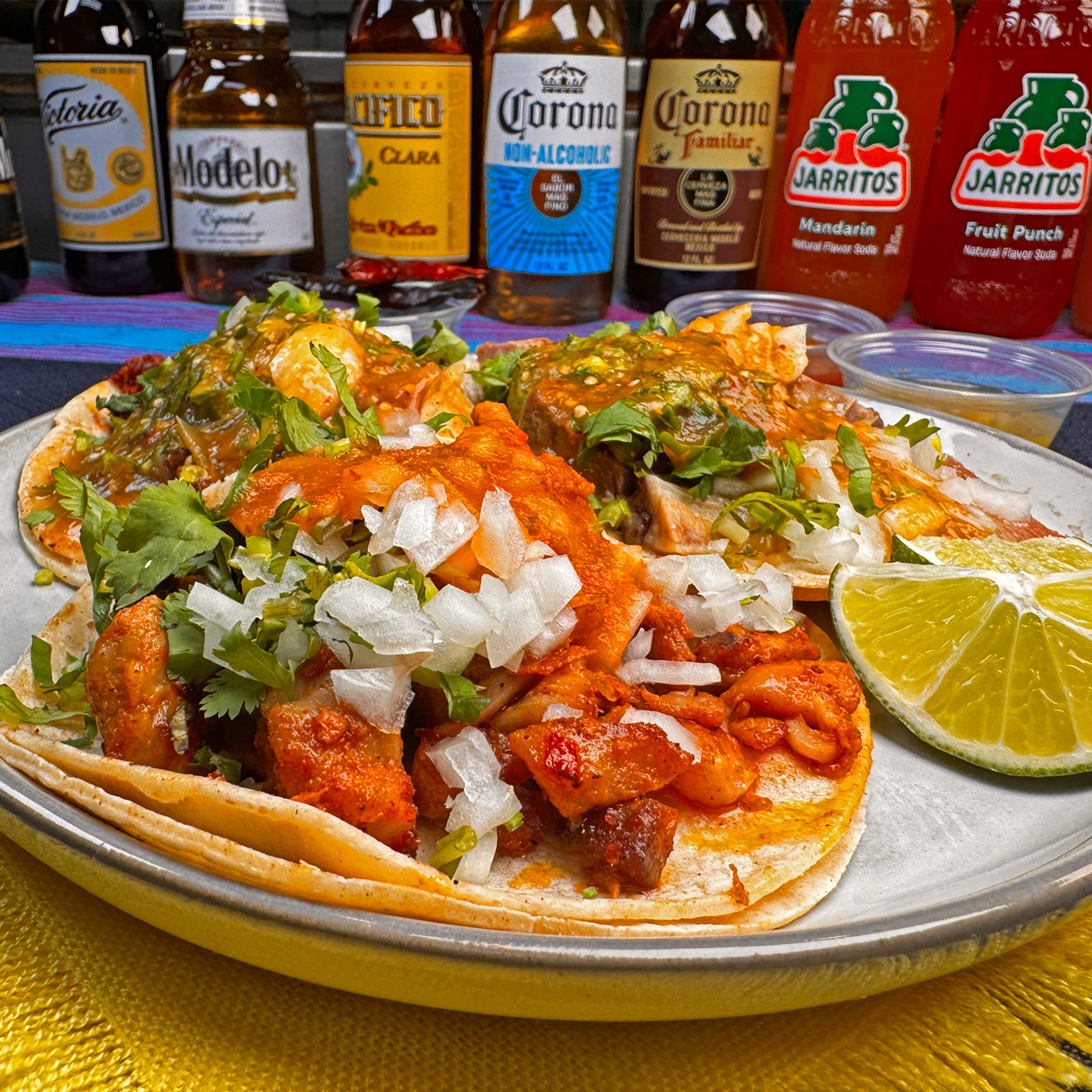Delicious grilled chicken on soft corn tortillas topped with onions, cilantro, and lime.